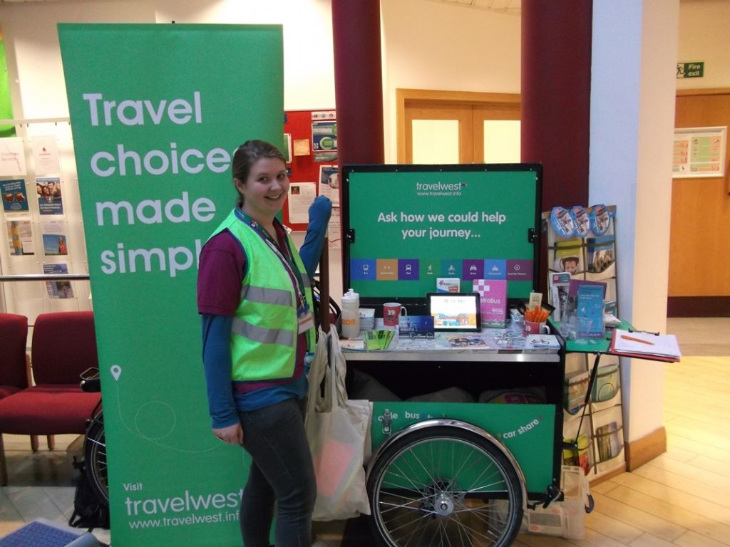 Our staff uses an adapted cargo bike as a way to setup a stand anywhere.