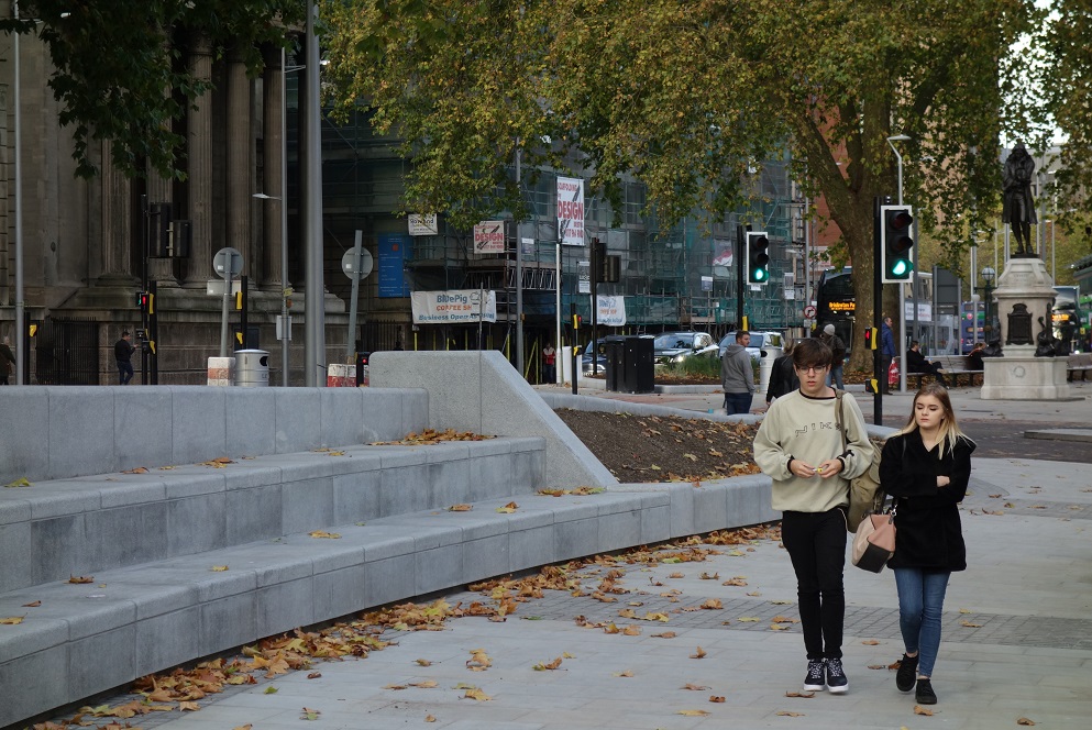 Bristol city centre after metrobus construction work - people walking past concrete steps