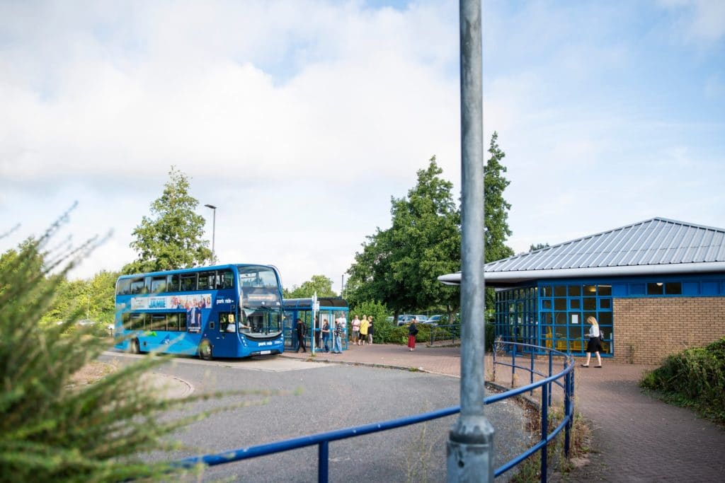 Brislington Park & Ride service picking up passengers at the bus shelter, with the waiting room next to it.