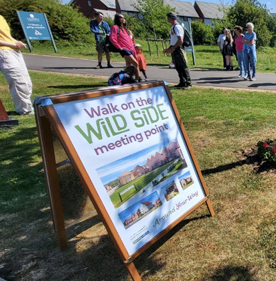 Photo of a promotional A-board sign marking the meeting point for the Walk on the Wild Side event.