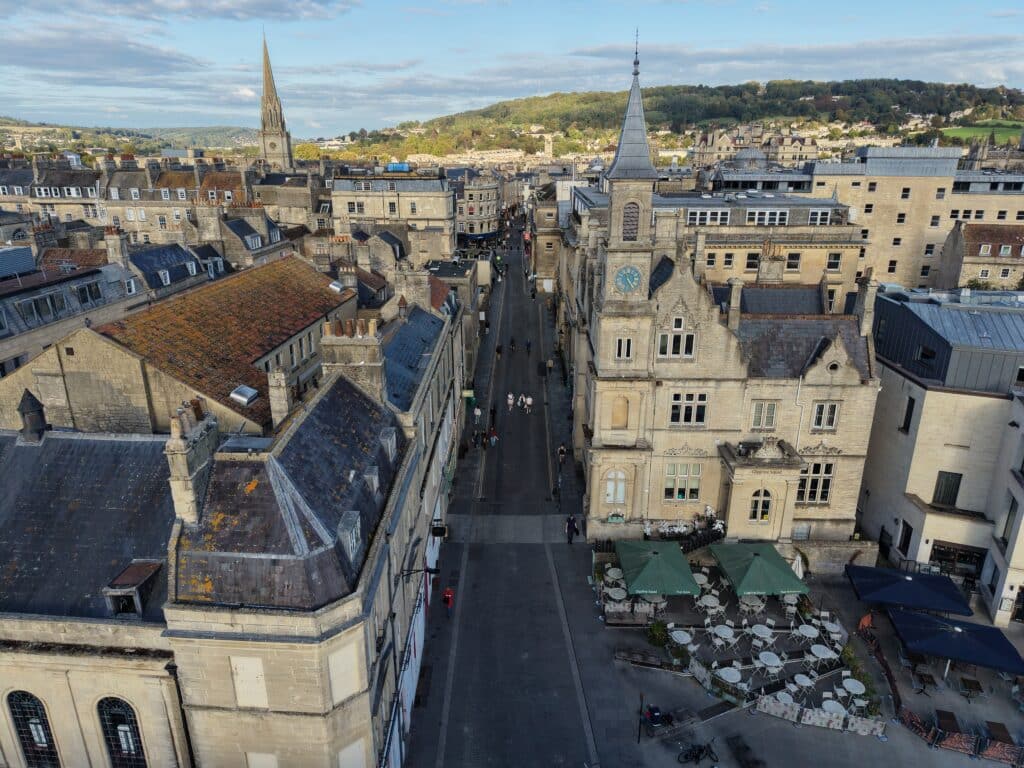 Ariel view of Bath City Centre with the skyline in the background.