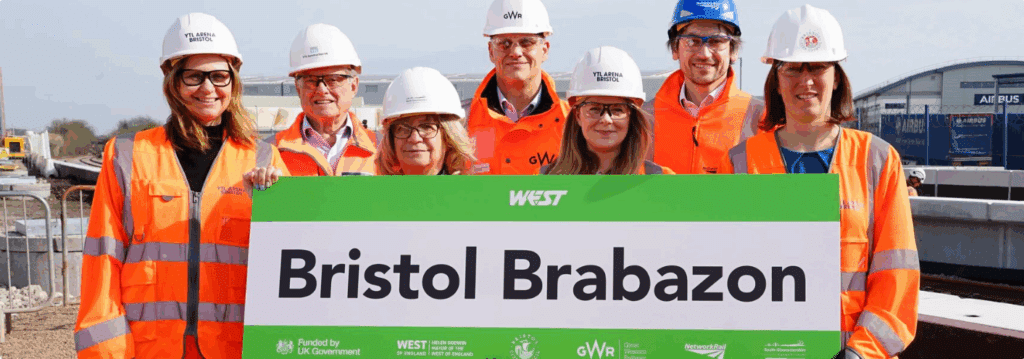 West of England Mayor Helen Godwin with other people in PPE holding a WEST branded sign with the name Bristol Brabazon on it.