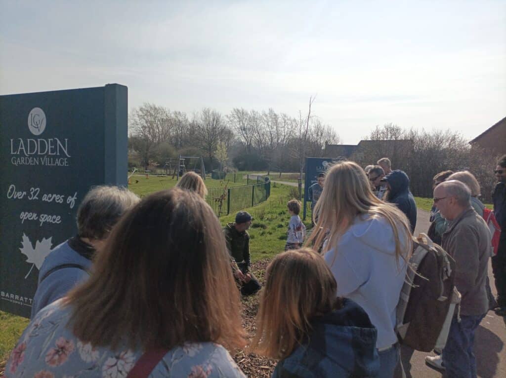 Photo of a group of people gathered around the walk leader at the meeting point for the Walk on the Wild Side event.