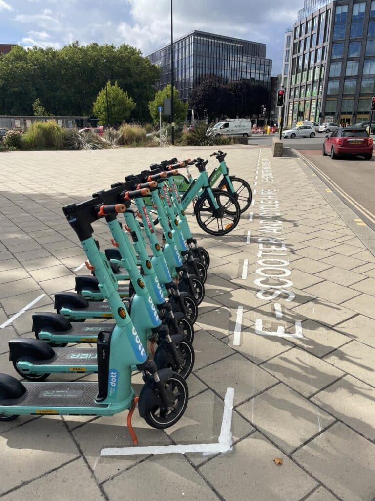 e-scooter and e-bike hire parking bay with Temple Quay in the background