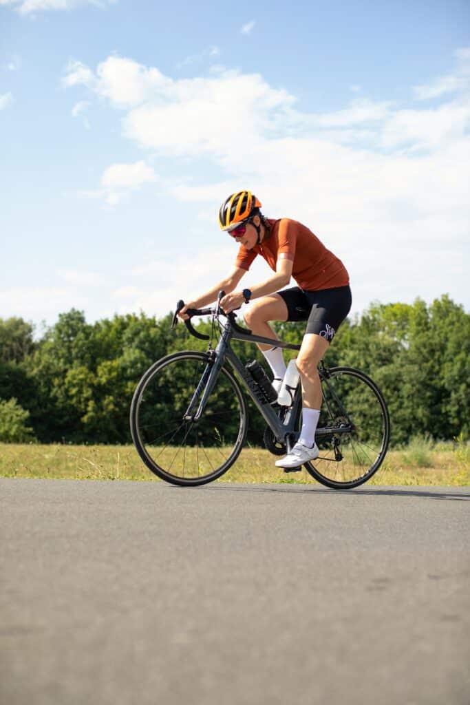 person on a bike with blue sky in the background