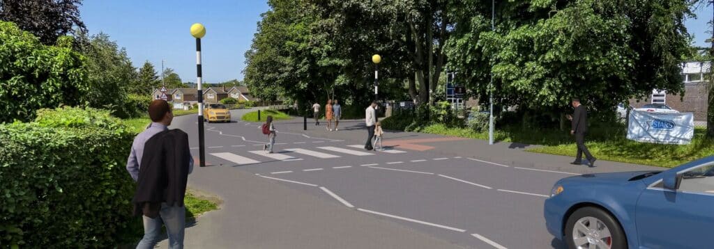 Visualisation showing a tree-lined street intersection with several pedestrians crossing at a marked crosswalk, cars passing by, and yellow-topped bollards along the sidewalk.